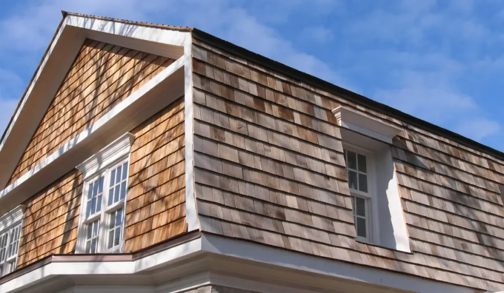 Cedar siding on a Naperville home with visible color variation from sun exposure and moisture changes