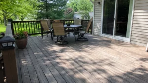 Outdoor wood finishing concerns on residential deck boards exposed to sunlight, tree shade, furniture, and foot traffic.